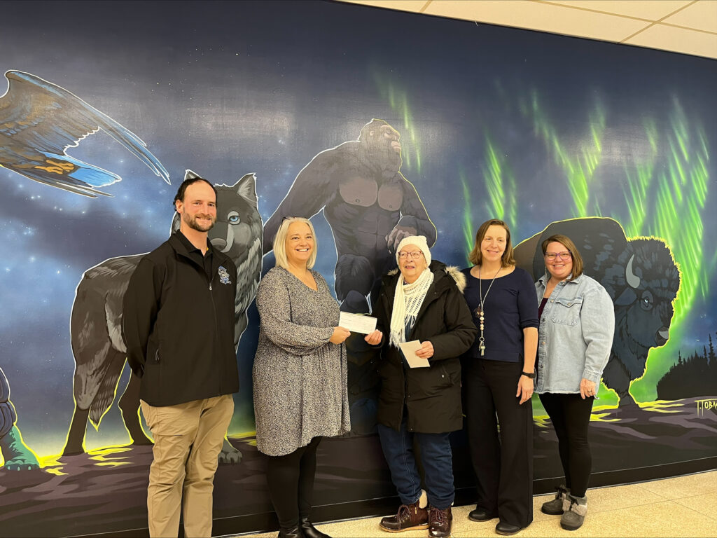 École Opasquia Staff with President of The Pas Association of Human Development -Joan Brown